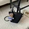 Detail of black matte suede bucket bag with leather handle and cute plush bear charm - Black with Pendant
