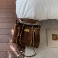 Quilted dark brown bucket bag with gold chain strap and metal turn-lock closure - Brown Small
