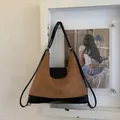 Detailed close-up of brown suede and black leather stitching on the tote bag - Black and Brown without Pendant