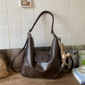 Detail of deep brown faux leather tote bag with flap closure and cute plush charm - Coffee With Pendant