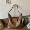 Detail of vintage brown PU leather shoulder bag with magnetic clasp and plush charm - Brown with Pendant