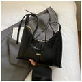 Detail of black leather hobo bag with gold zipper and knotted shoulder strap - Black