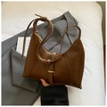 Detailed view of deep brown vintage handbag with unique trapezoid base and decorative buckle - Brown