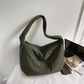 Deep green nylon crescent bag with wide padded strap and small matching pouch charm - Green