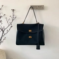 Detail of black suede tote bag with double gold twist locks and elegant top handle - Black Large