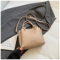 Chic beige lychee textured bucket bag with circular handles and adjustable strap - Khaki (Without Charm)