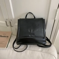 Minimalist black leather backpack for women with fold-over flap and embossed detail - Without Pendant / Black