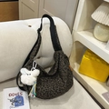 Large leopard print crossbody bag with wide black strap and plush bear pendant detail - Green Leopard With Charm