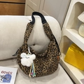 Large leopard print hobo bag with teddy charm and black woven wide shoulder strap - Brown Leopard With Pendant