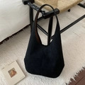 Macro detail of black suede Hobo bag showing soft matte texture and large capacity - Black