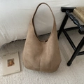 Close-up of a camel suede hobo tote bag featuring a magnetic clasp and soft velvet texture - Khaki