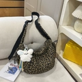 Large leopard print crossbody crescent bag with adjustable wide strap and plush charm - Khaki Leopard Print with Charm