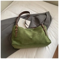 Detail of dark green suede tote bag with brown leather strap and gold hardware accents - Green