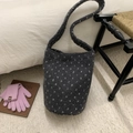 Detail of grey polka dot fleece bucket bag showing soft texture and integrated strap - Gray
