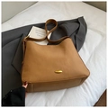 Detailed view of khaki brown leather bucket bag with golden oval buckle and wide strap - Brown