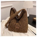 Detail of plush brown tote bag featuring fleece texture and checkered inner lining - Brown Long Strap