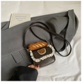 Detail of vintage brown mini crossbody bag featuring lace trim and bear embroidery - Brown