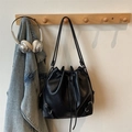 Minimalist black leather drawstring bucket bag with adjustable shoulder strap and metal buckle - Black (Without Charm)