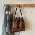 Vintage brown drawstring bucket bag with premium leather texture and metallic details - Brown (Without Pendant)