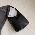 Minimalist black faux leather hobo shoulder bag with adjustable strap and wide band - Black PU Leather