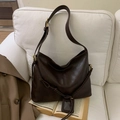 Retro deep brown leather tote bag with wide strap on sofa, minimalist aesthetic style - Coffee No Charm