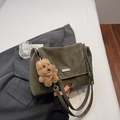 Detail of olive green vintage textured shoulder bag with silver chain and teddy charm - With Pendant / Green