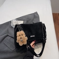 Detail of black matte shoulder bag with silver hardware and a cute teddy bear charm - With Pendant / Black