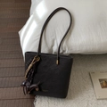 Close-up of black matte tote bag with gold lettering and a cute dachshund puppy charm - Ebony (With Pendant)