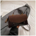 Detail of brown leather and suede stitching bag with gold metal handle and shoulder strap - Matte Coffee