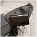 Detail of dark brown glossy leather handbag with vintage gold hardware and dual-use strap - Brown