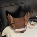Brown large capacity crescent canvas bag with wide shoulder strap and woven zipper detail - Coffee