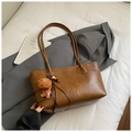 Vintage brown leather tote bag with long straps and a cute gingerbread man plush charm - Coffee with Pendant