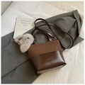 Chic brown leopard print bucket bag with dual texture leather and cute rabbit charm - Leopard Coffee With Charm