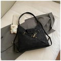 Detail of black matte Hobo bag with gold hardware and plush bear charm decoration - Black With Pendant