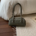 Detail of olive green suede cylinder shoulder bag with gold logo and white stitching - Green Without Pendant