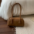 Detailed close-up of brown suede hobo bag featuring white contrast stitching and gold logo - Brown No Pendant