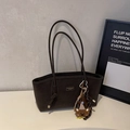 Detailed close-up of brown frosted leather tote bag with embroidery bear charm - Coffee With Charms
