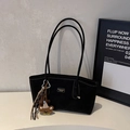 Close-up of black suede tote bag with contrast stitching and decorative animal charm - Black With Pendant