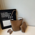Detailed view of brown leather bucket bag set with matching inner pouch and shoulder strap - Khaki