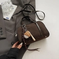Detail of dark brown suede bowling bag featuring vintage baseball charms and leather trim - With Pendant / Brown