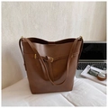 Brown leather tote bag with adjustable strap and buckle detail for stylish commuting - Brown