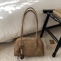Detail of tan suede shoulder bag with long straps and ethnic wooden bead charm - With Pendant / Brown