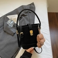 Black bucket bag in matte finish with a cute brown teddy bear charm and gold hardware - Black With Pendant