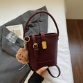 Vintage burgundy bucket bag with plush dog charm and gold hardware clasp - Wine Red With Pendant