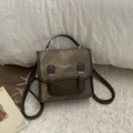 Vintage brown leather college style backpack with metallic buckles and top handle - Coffee without Pendant