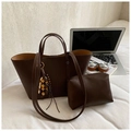 Detail view of coffee brown leather tote with wooden bead charm and matching pouch - Coffee With Pendant