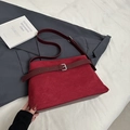 Macro detail of dark red frosted suede tote with stitching and metallic belt buckle decoration - Red