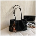Detail of black suede tote bag featuring white contrast stitching and a small bear charm - Large Underarm Tote Bag / Black (With Pendant)