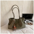 Detailed view of olive suede tote bag with white stitching and cute bear charm - Large Underarm Tote Bag / Green (With Pendant)