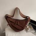 Macro detail of dark brown crescent bag featuring pleated nylon texture and woven zipper - Large / Coffee